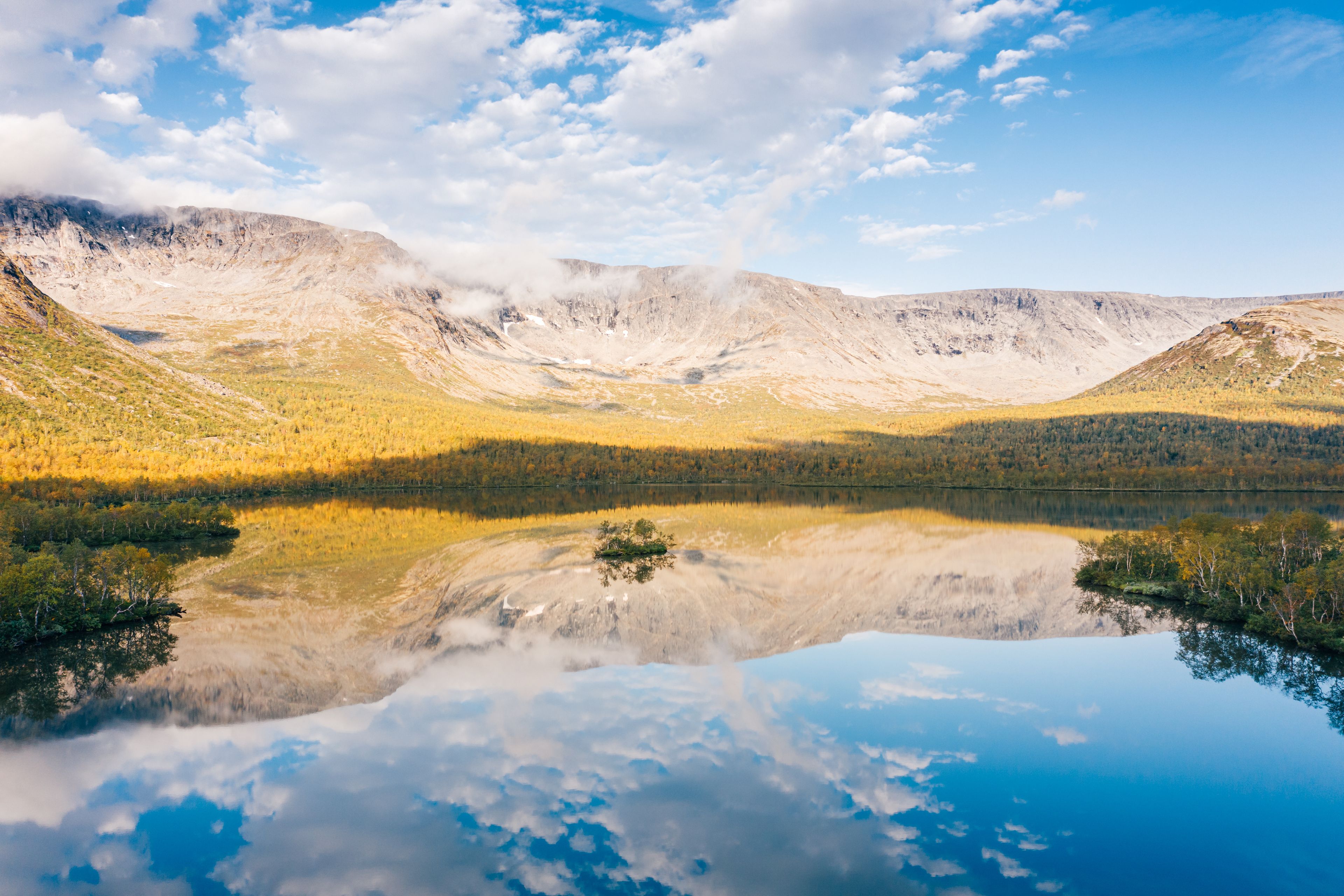 Beautiful valley of Lake Malyy Vudyavr (Small Woodyavr) in Khibiny Mountains, aerial view. Northern nature landscape in sunny autumn morning. Kola Peninsula, Murmansk Oblast, Russia