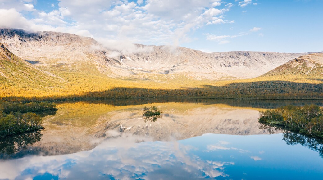 Beautiful valley of Lake Malyy Vudyavr (Small Woodyavr) in Khibiny Mountains, aerial view. Northern nature landscape in sunny autumn morning. Kola Peninsula, Murmansk Oblast, Russia