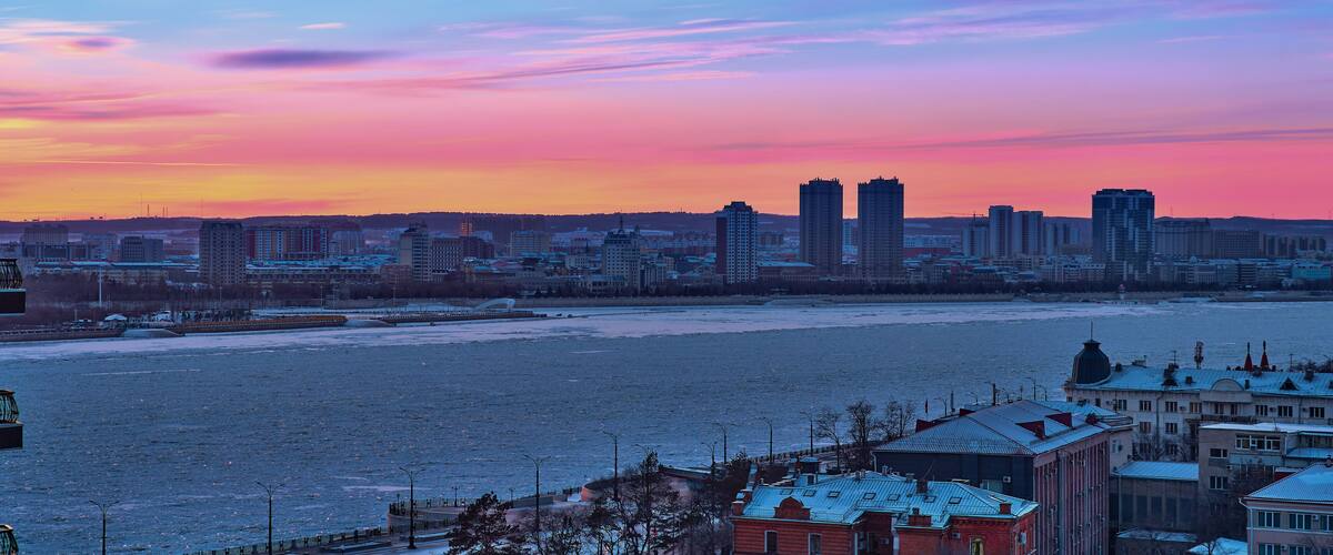 Blagoveshchensk, Russia - Dec 24, 2020: View of the Chinese city of Heihe from the embankment of the city of Blagoveshchensk.