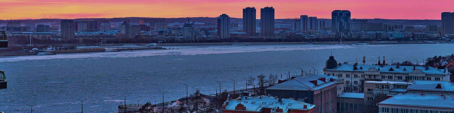 Blagoveshchensk, Russia - Dec 24, 2020: View of the Chinese city of Heihe from the embankment of the city of Blagoveshchensk.