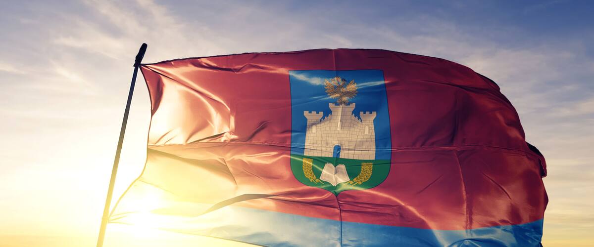 Oryol oblast of Russia flag waving on the top sunrise mist fog