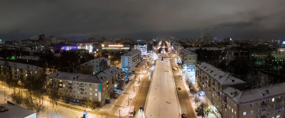 panorama of the Russian city of Kirov from a height on a winter night. Oktyabrsky Avenue in the New Year holidays.