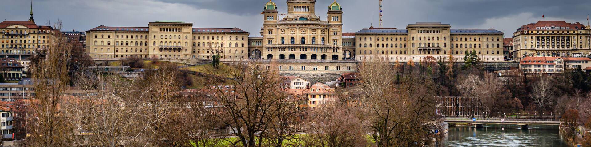 View of the complex of buildings of the Swiss Parliament shot from the Monbijou bridge over the Aare river