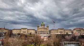 View of the complex of buildings of the Swiss Parliament shot from the Monbijou bridge over the Aare river