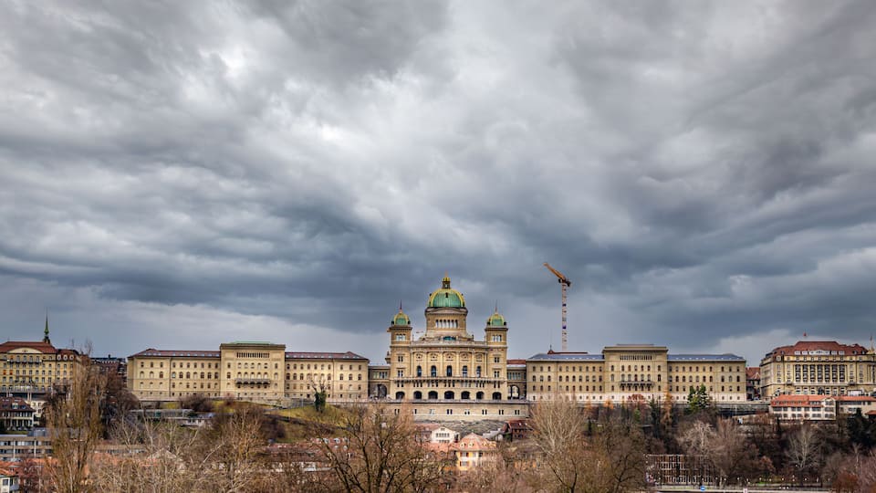 View of the complex of buildings of the Swiss Parliament shot from the Monbijou bridge over the Aare river