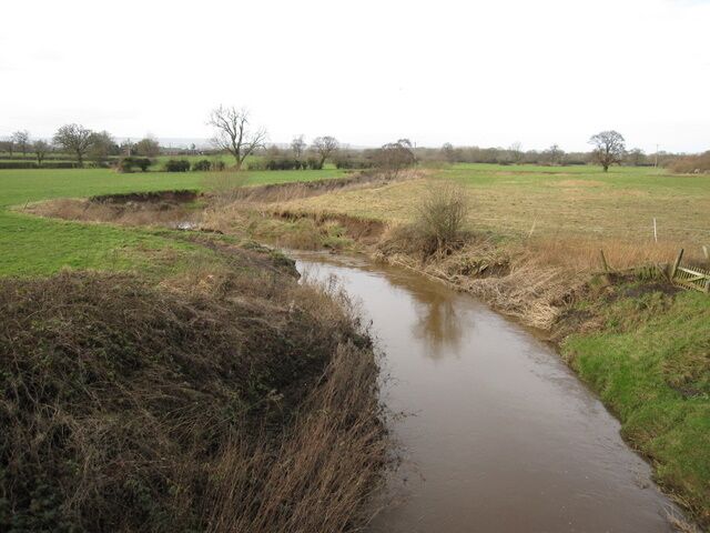View from Worthenbury Bridge Looking downstream along Worthenbury Brook as it makes its way towards the River Dee/Afon Dyfrdwy.