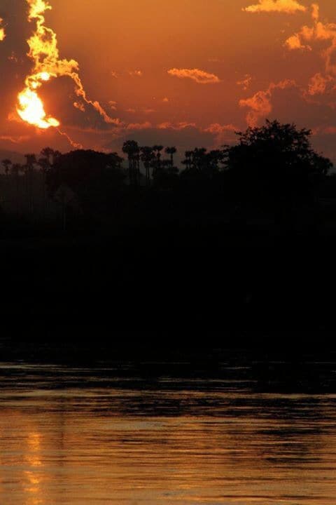 This photo was taken on a day long boat ride from Mandalay to Old Began. The section designated for Westerners consisted of white plastic lawn chairs for comfort. This boat however was more for locals traveling between small towns. It was a wonderful experience to sit with the locals and converse with them as best we could. Along the way we saw farmers riding ox-plows, food supplies being dropped-off/picked-up, and Buddhist monks taking an afternoon stroll. #goldenhour #burma #myanmar #bagan #mandalay #sunset #colorful