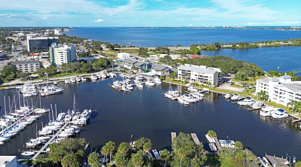 Aerial view of the yacht harbor basin with boats and nearby condos in historic downtown Melbourne along Florida's Space Coast in Brevard County