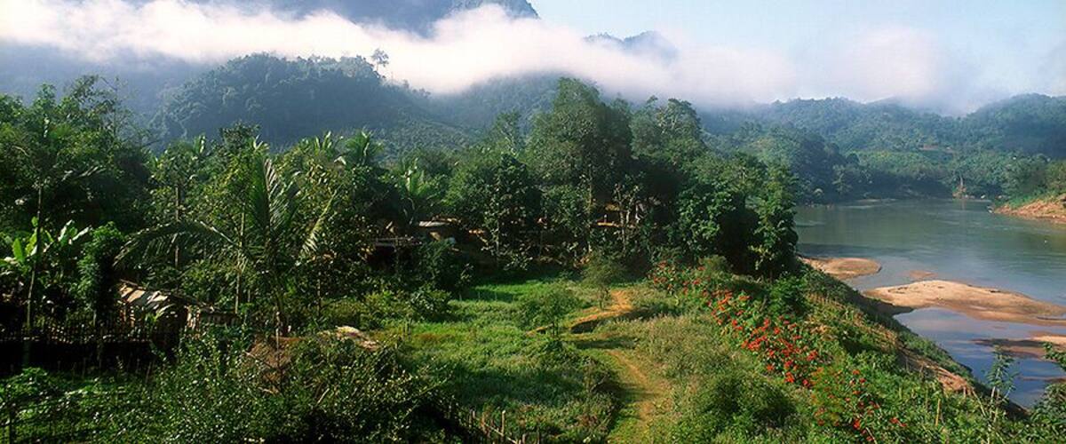 On the Mekong River in far northern Laos near the Chinese border. Do a river cruise from Luang Prabang. Take at least a week to explore this relatively remote and fascinating part of the world. Beautiful scenery and people. Don't stray too far on your wanders as there's perhaps some unexploded ordnance hiding off the beaten track.