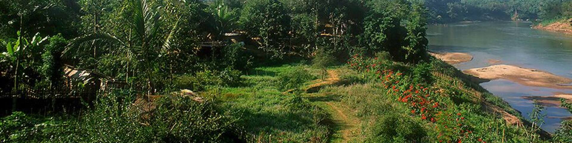 On the Mekong River in far northern Laos near the Chinese border. Do a river cruise from Luang Prabang. Take at least a week to explore this relatively remote and fascinating part of the world. Beautiful scenery and people. Don't stray too far on your wanders as there's perhaps some unexploded ordnance hiding off the beaten track.