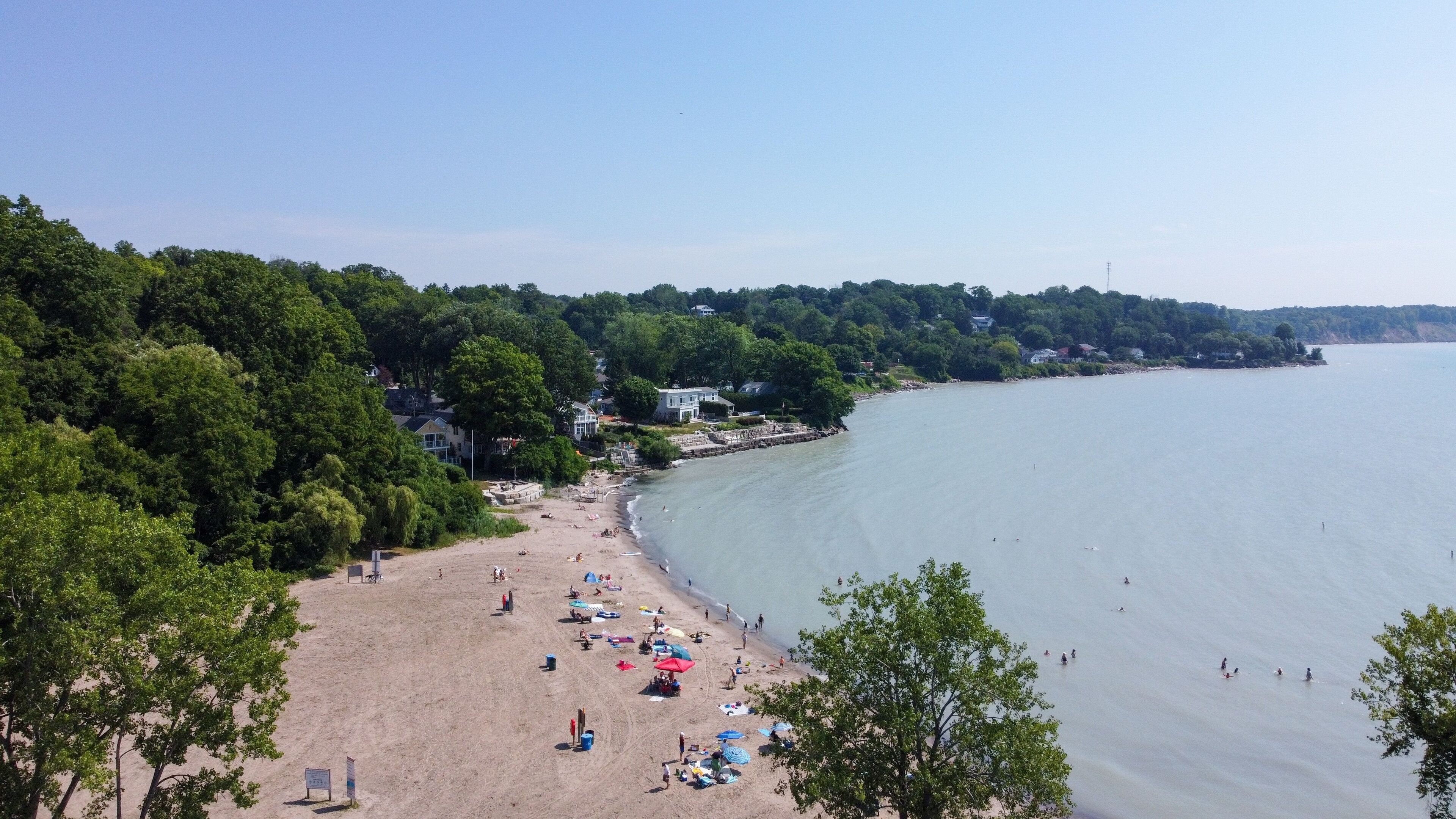 Aerial view of people vacationing on the sandy beach by Lake Erie in Port Stanley, Ontario, Canada