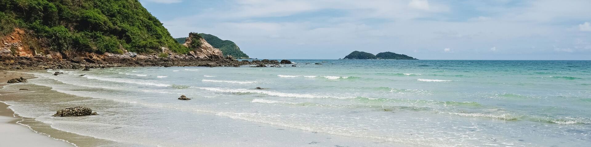 Smooth white sand and clear water at Nam Sai Beach, Sattahip District, Chonburi Province, Thailand. Tropical sea tourism.