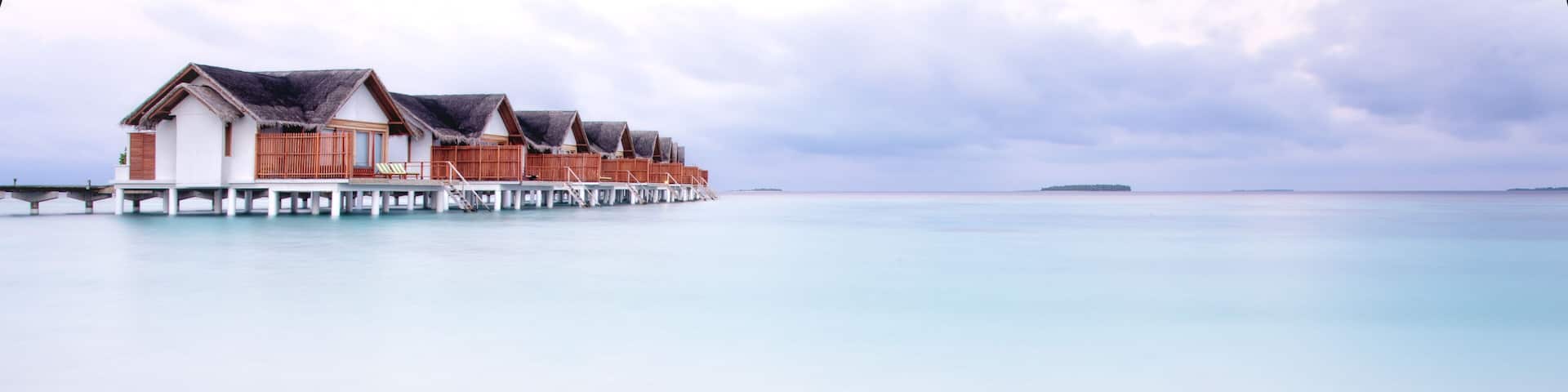 Maldives White Sand Beach Bungalows at Dawn