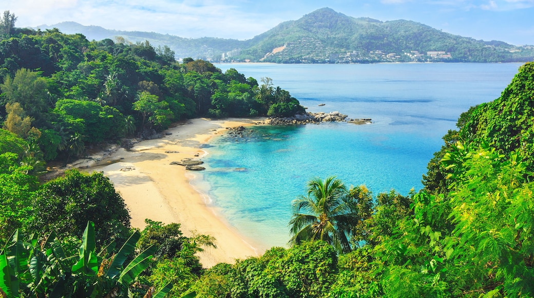 Picturesque view of Andaman sea in Phuket island, Thailand. View through the jungle on the beautiful bay and mountains. Tropical beach Laem Singh.