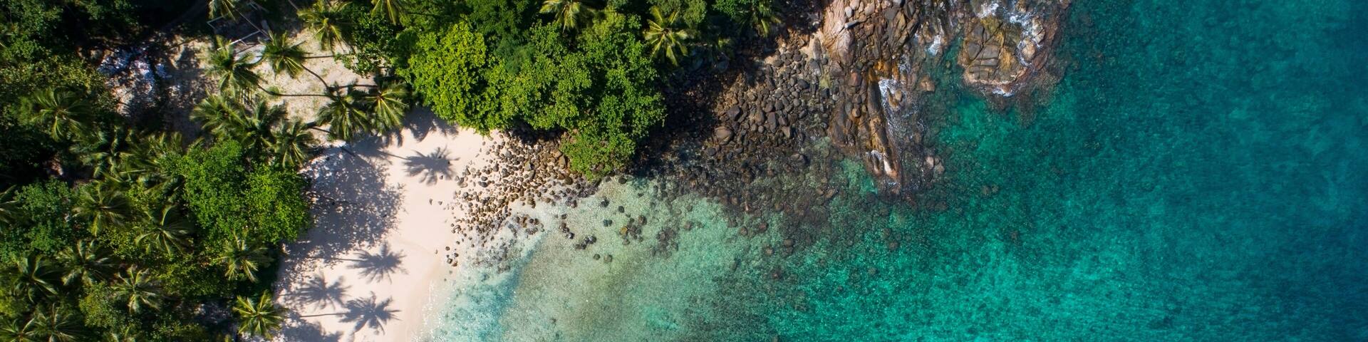 Amazing top view beach Aerial view of Tropical beach sea in the beautiful Phuket island Located at Freedom beach Phuket Thailand