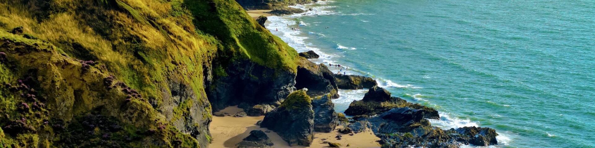 Looking along coastline towards Llangrannog village and beach in Pembrokeshire, Wales, UK