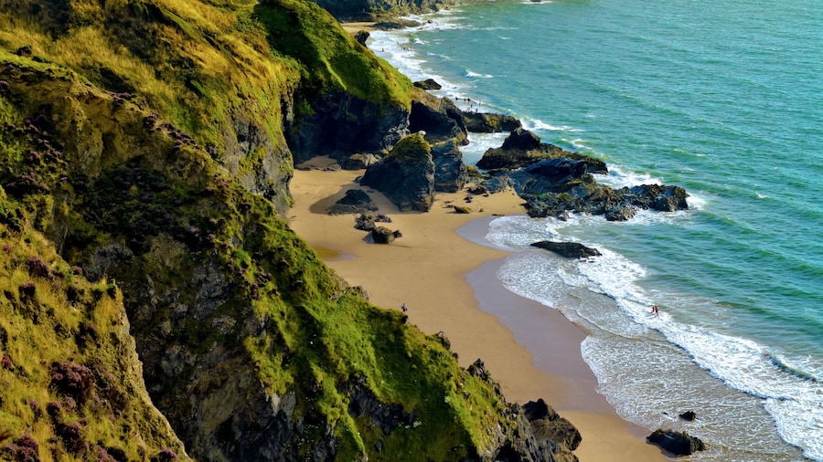 Looking along coastline towards Llangrannog village and beach in Pembrokeshire, Wales, UK