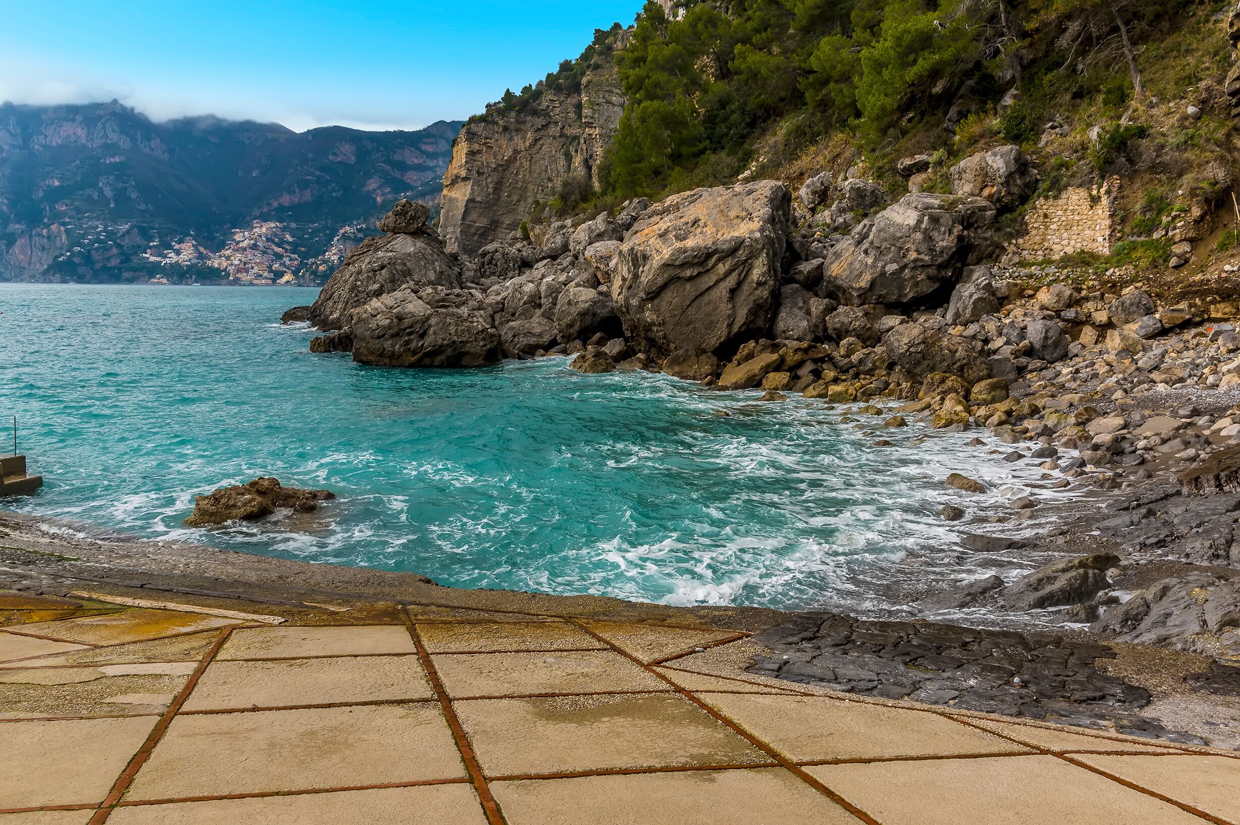 The sea laps the shore at Gavitella Beach in Praiano. Italy on the Amalfi coast
