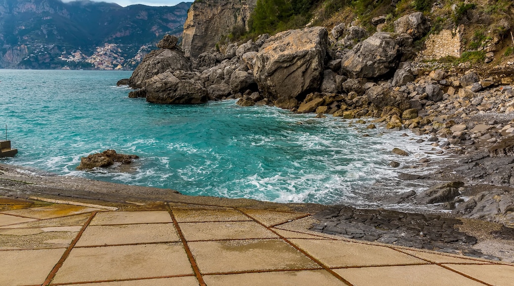 The sea laps the shore at Gavitella Beach in Praiano. Italy on the Amalfi coast