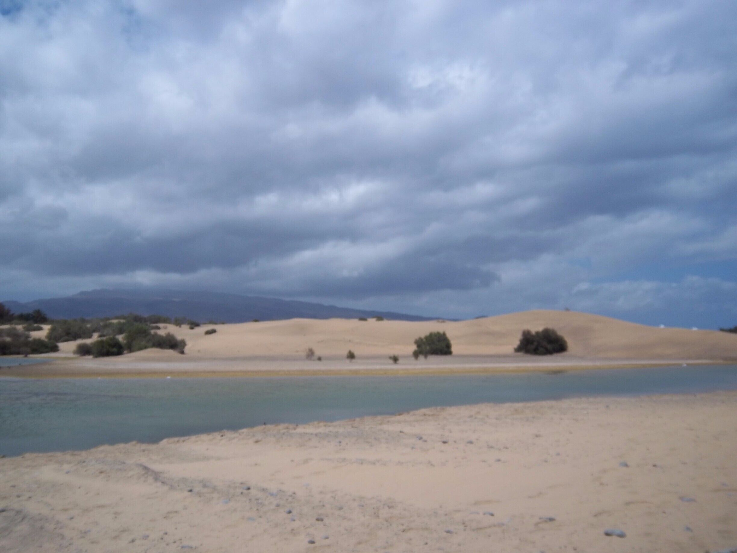 Nudist beach famous for its sand dunes.