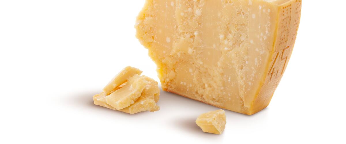 Aged parmesan cheese or parmigiano reggiano isolated on a transparent background