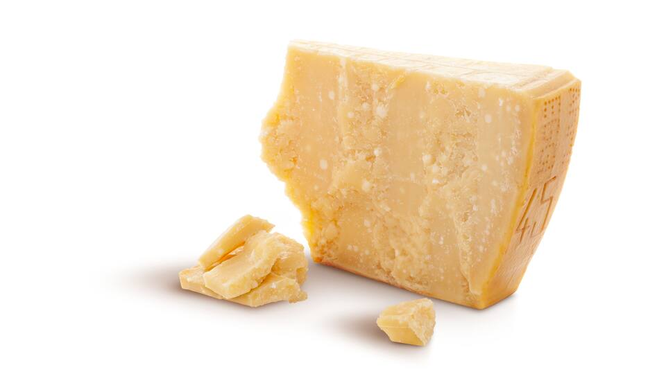 Aged parmesan cheese or parmigiano reggiano isolated on a transparent background