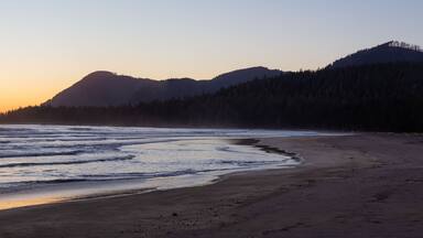 Beautiful sandy beach on the Pacific Ocean Coast during a vibrant summer sunset. Taken in Raft Cove Provincial Park, Northern Vancouver Island, BC, Canada.