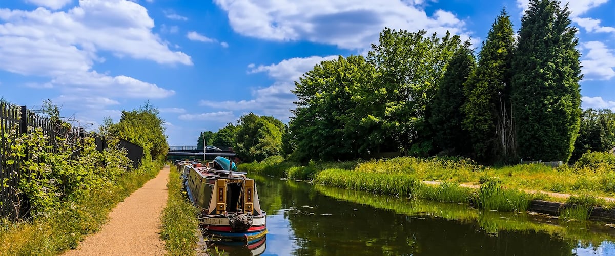 Narrowboats moored on the Birmingham Canal at Tipton in summertime