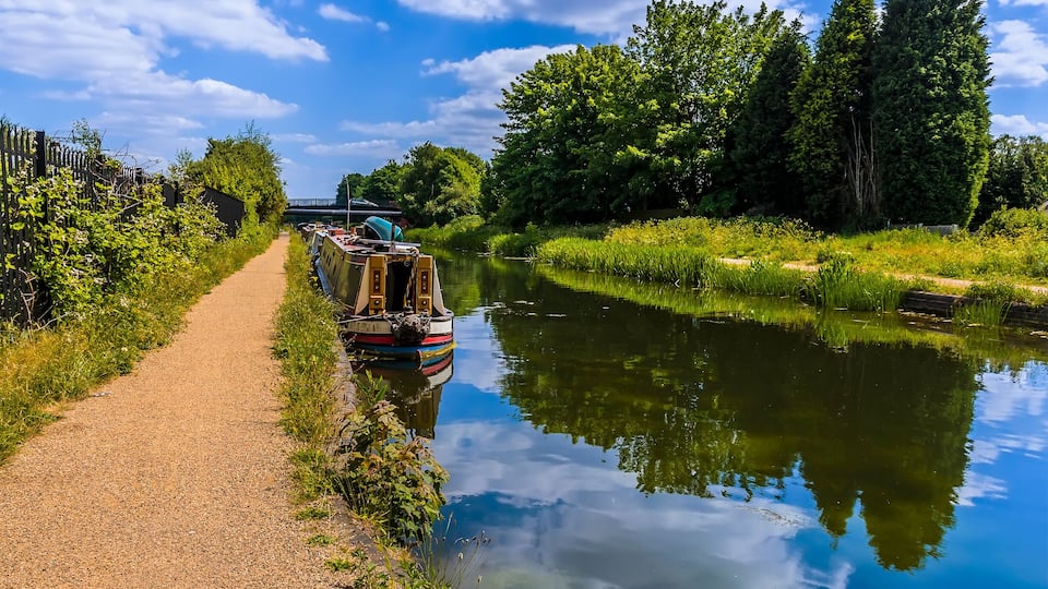 Narrowboats moored on the Birmingham Canal at Tipton in summertime