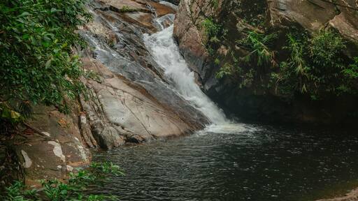 Flowing water of Jelawang Waterfall in Gunung Stong, Dabong, Kelantan, Malaysia.