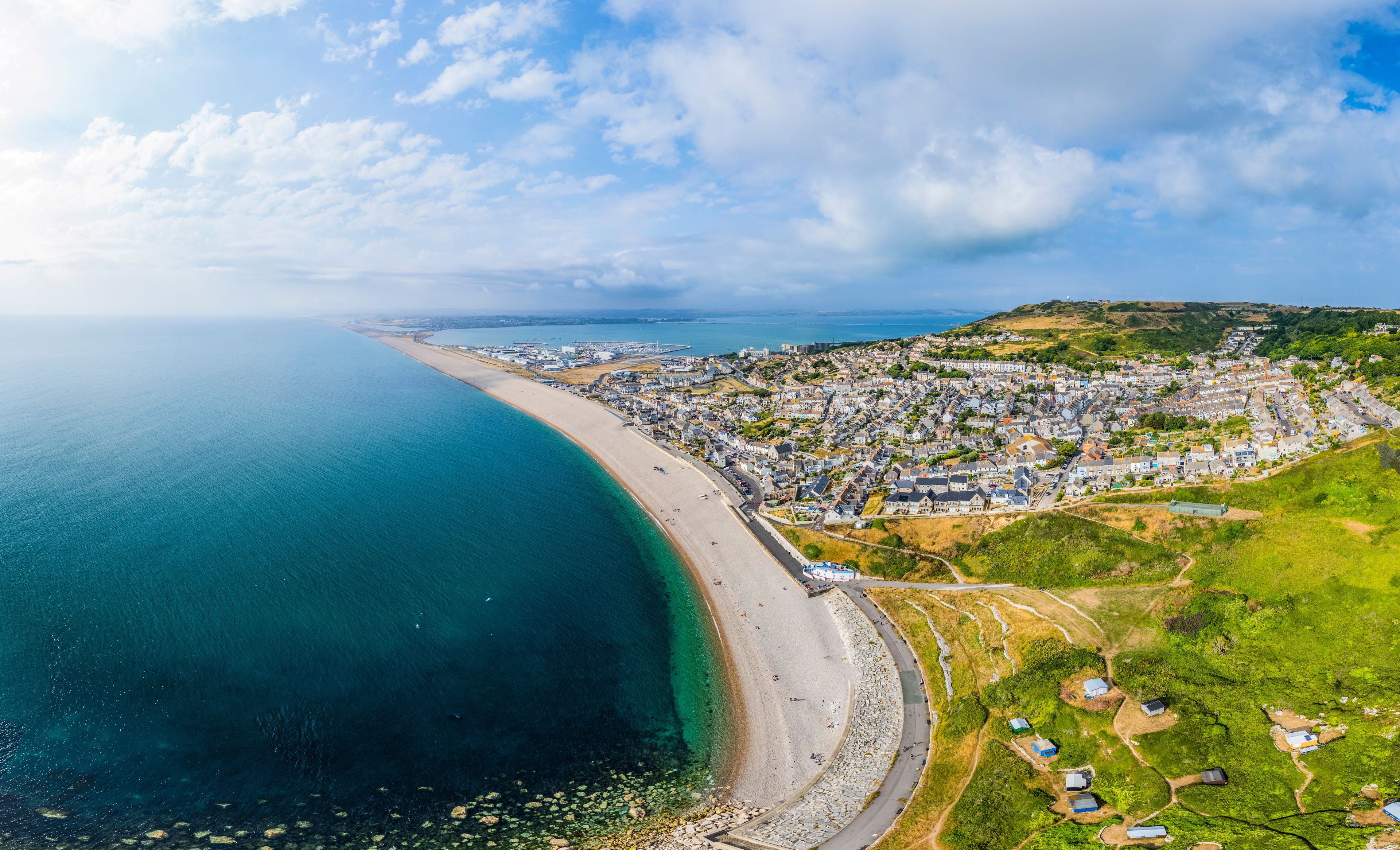Aerial panorama of Chesil beach and Castletown, Jurassic coast, UK.