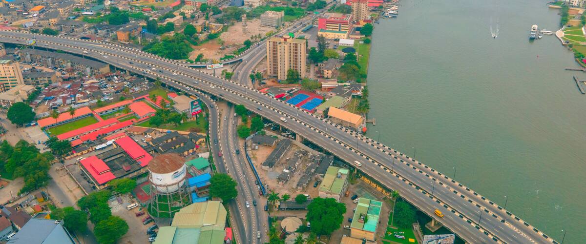 Aerial view of beautiful cityscape with bridge over river and skyline of buildings, Onikan, Nigeria.
