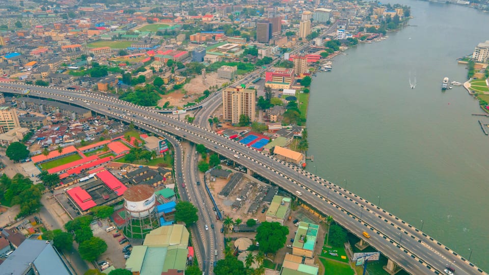 Aerial view of beautiful cityscape with bridge over river and skyline of buildings, Onikan, Nigeria.