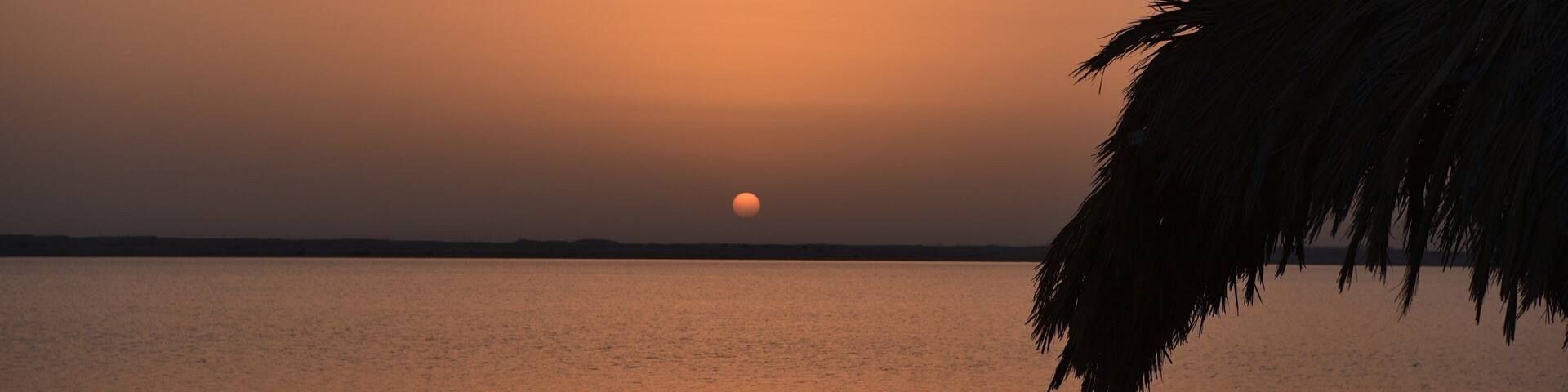 Zekreet Beach showing a sunset and general coastal views