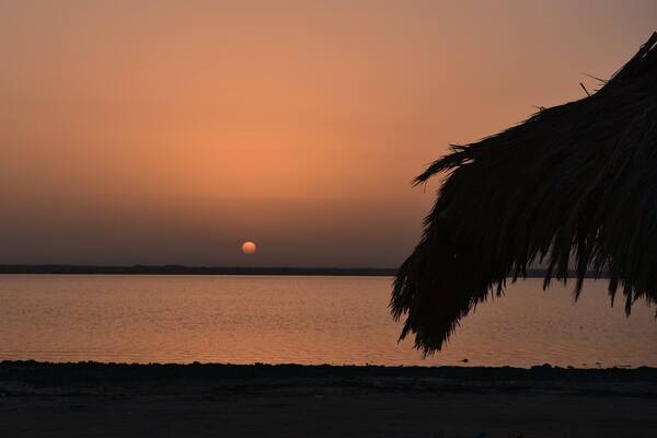 Zekreet Beach showing a sunset and general coastal views