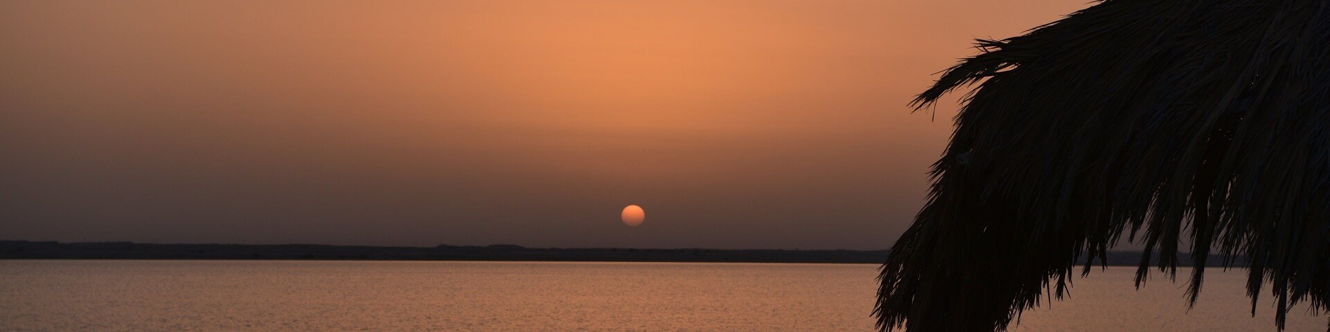 Zekreet Beach showing a sunset and general coastal views