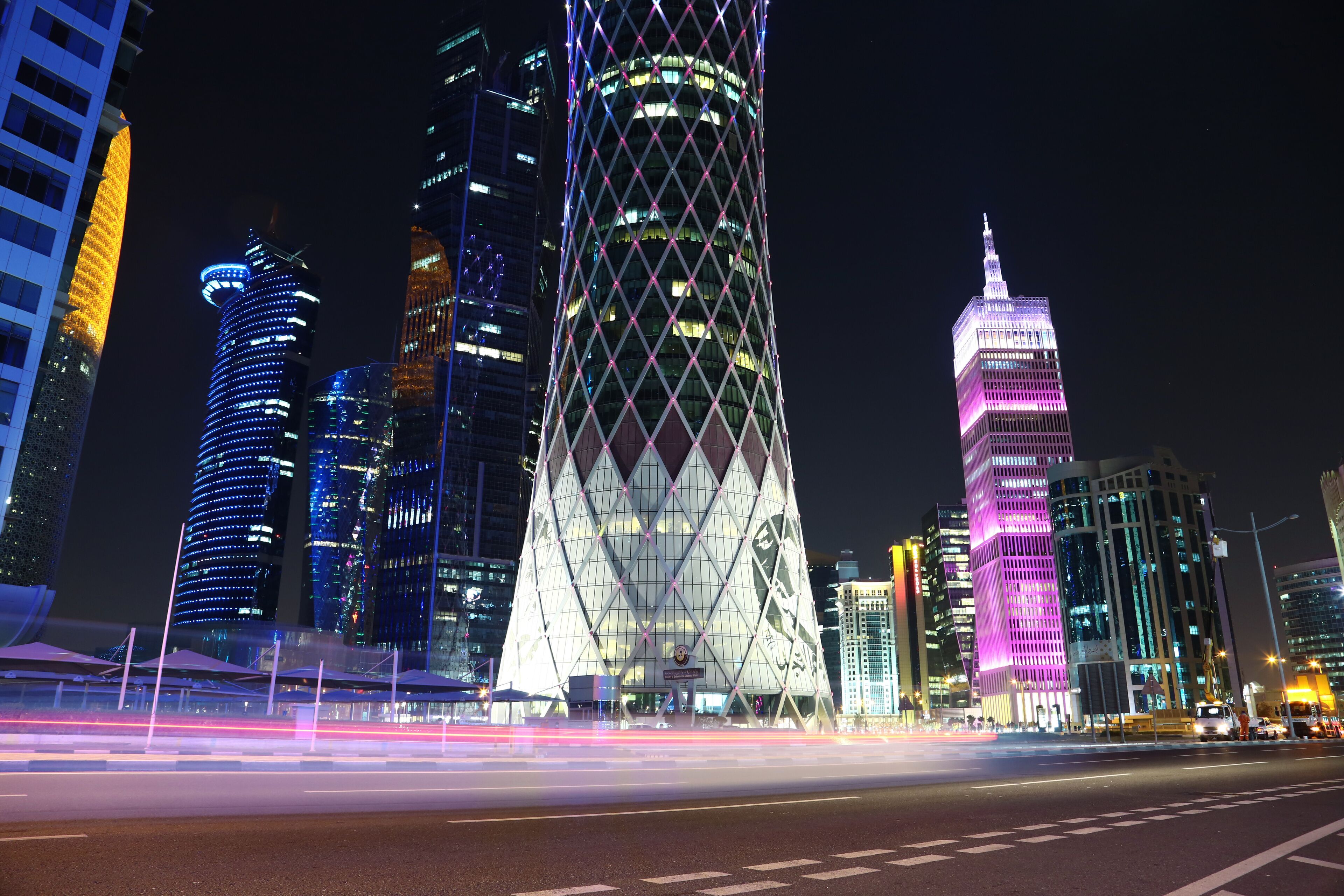 Night road traffic in financial centre in Doha, Qatar