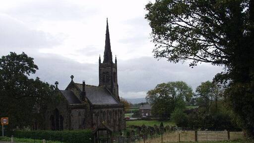 St John The Baptist at Penymynydd. Great Church building which is fully illuminated at night.