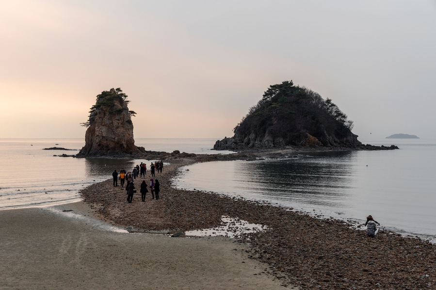 View of the seaside during sunset
