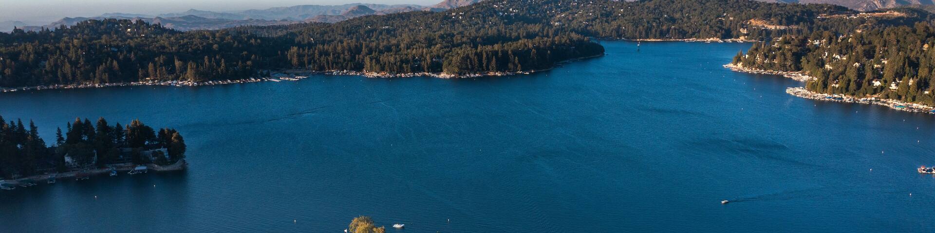 Sunset view of the historic lakefront buildings of the downtown village of Lake Arrowhead, California, USA.