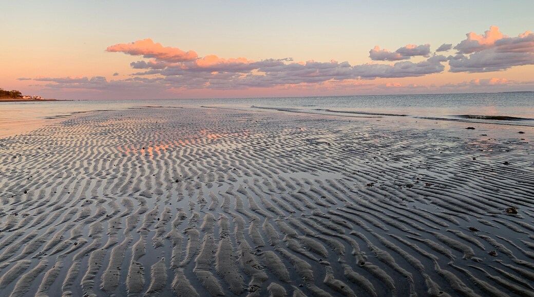 Sunset looking East from Stratford CT over the sands of lowtide and Long Island Sound