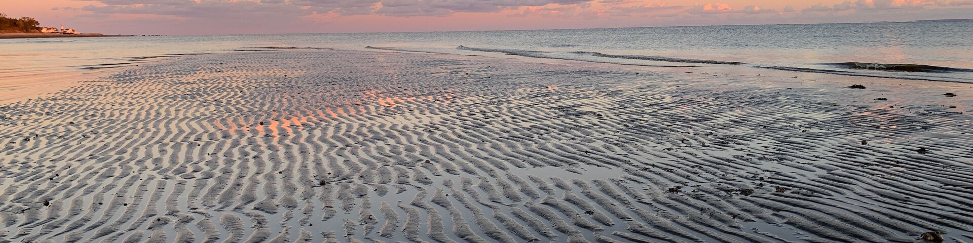 Sunset looking East from Stratford CT over the sands of lowtide and Long Island Sound