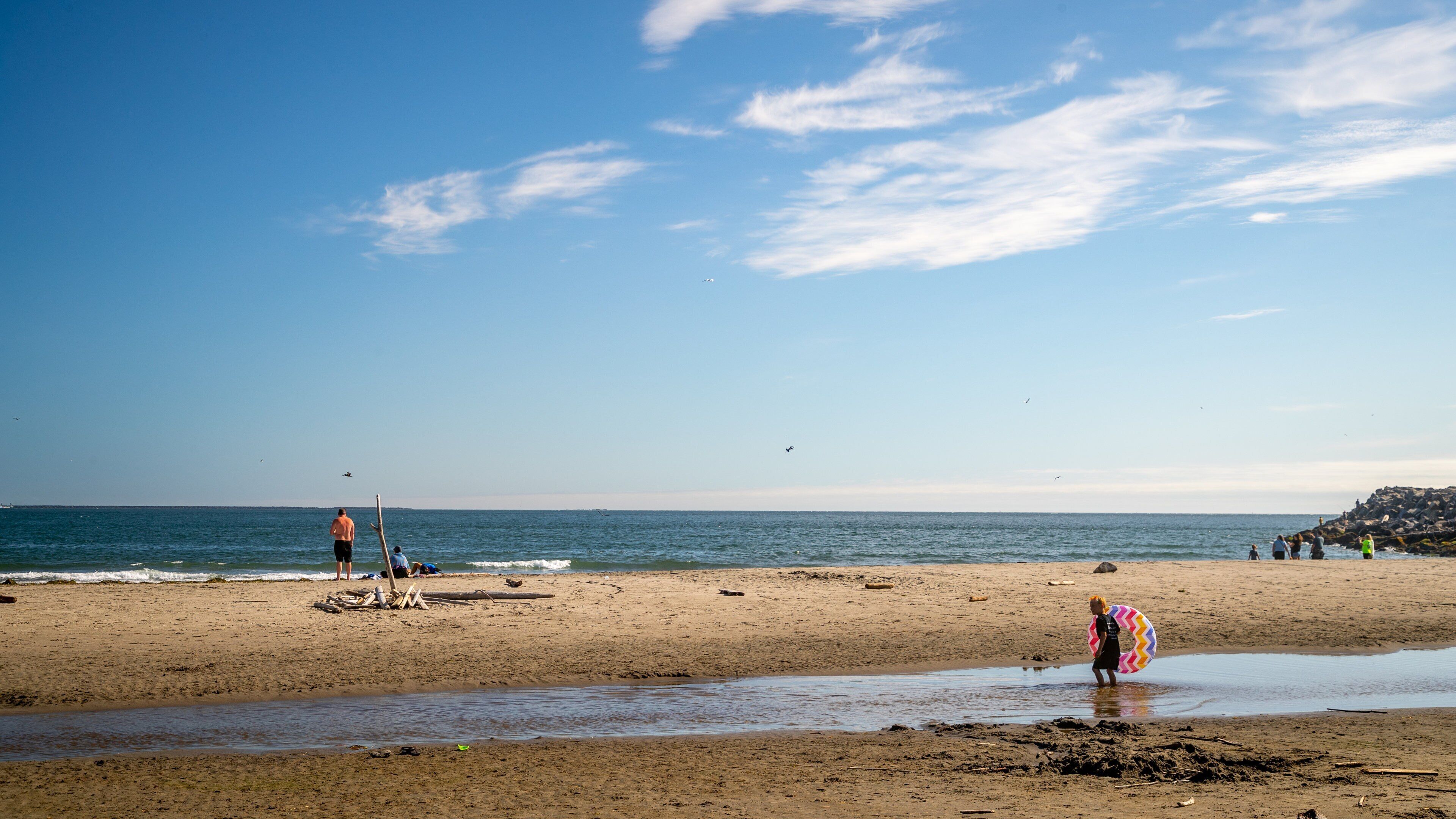 Waikiki Beach showing a beach and general coastal views as well as an individual child