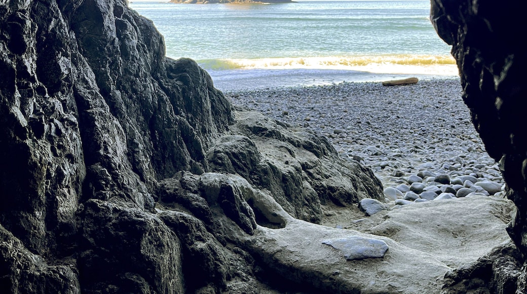 Tunnel Beach cave opening with Oregon Coast rocks in the distance with natural framing