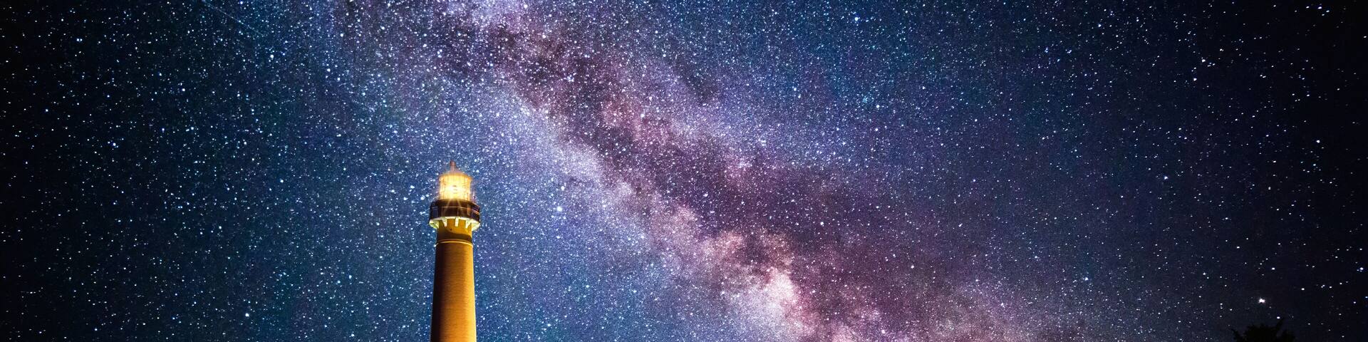 Barnegat Lighthouse under a starry night. Barnegat Lighthouse is a historic lighthouse located in Barnegat Lighthouse State Park in New Jersey
