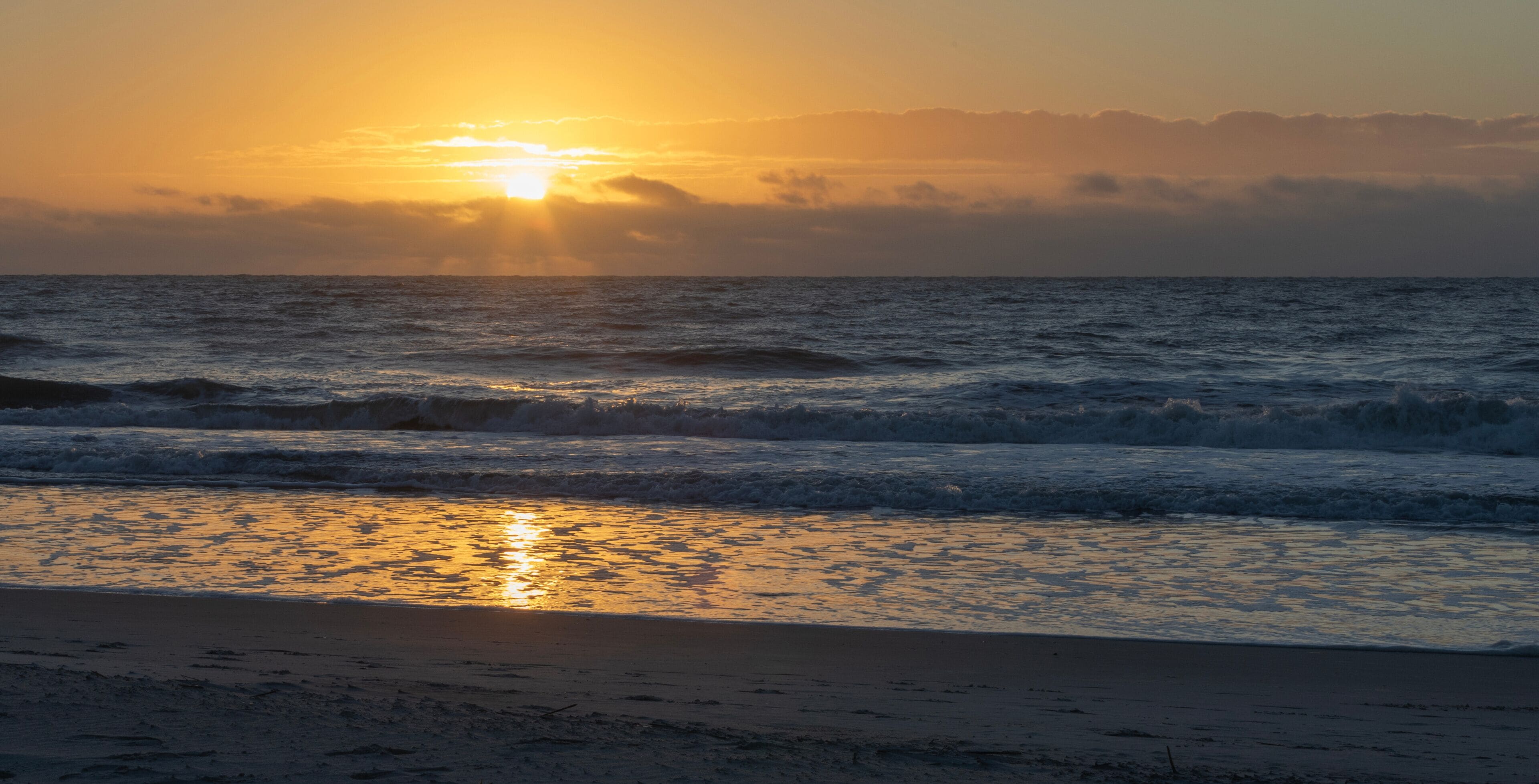 Bright sun low on the horizon over the Atlantic