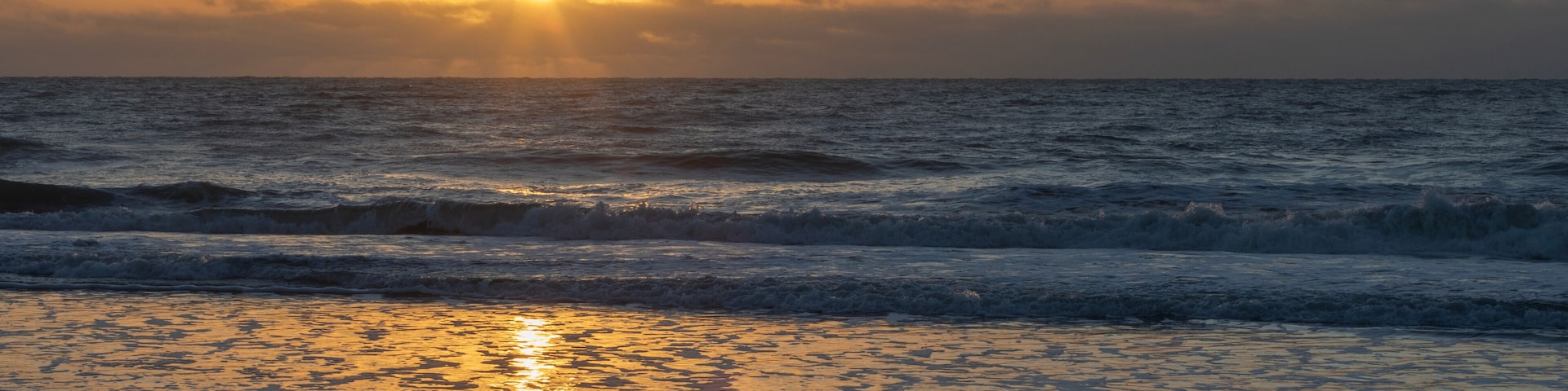 Bright sun low on the horizon over the Atlantic