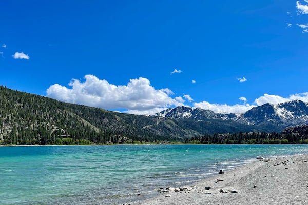 June Lake against a background of mountains and sky in the daylight in California, USA