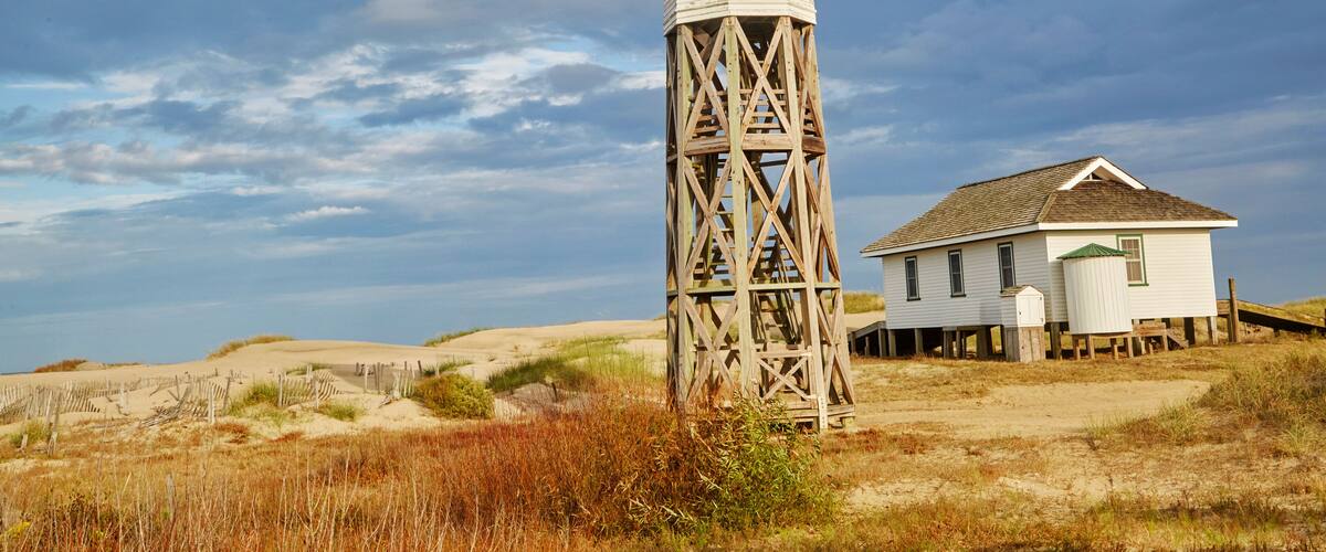 Wood lookout and lighthouse overlooking the outer banks of North Carolina