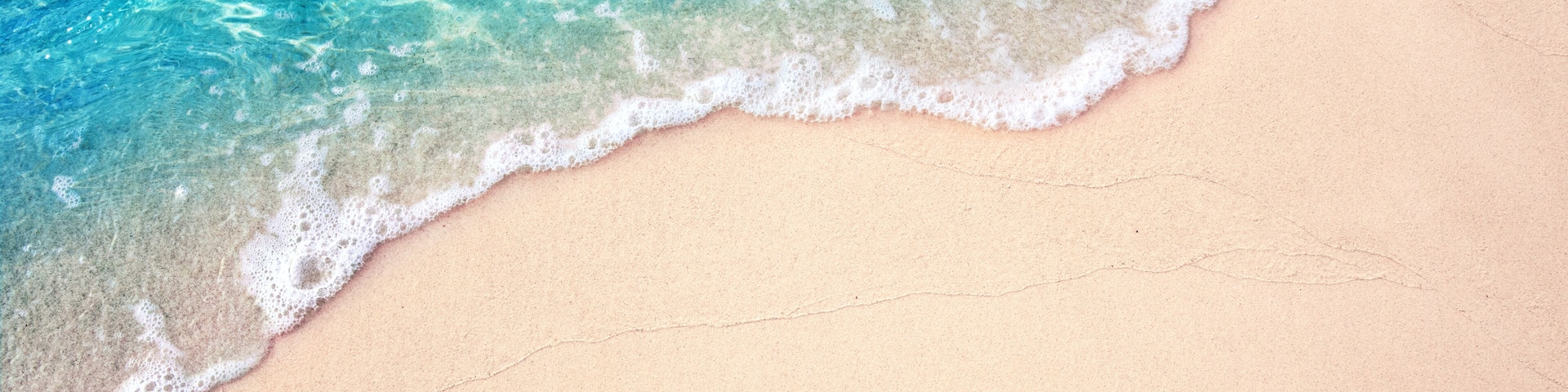 Beautiful Soft blue ocean wave on fine sandy beach